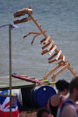 Wooden dinosaur on the beach