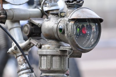 Old gas powered motorcycle light on a pioneer motorcycle